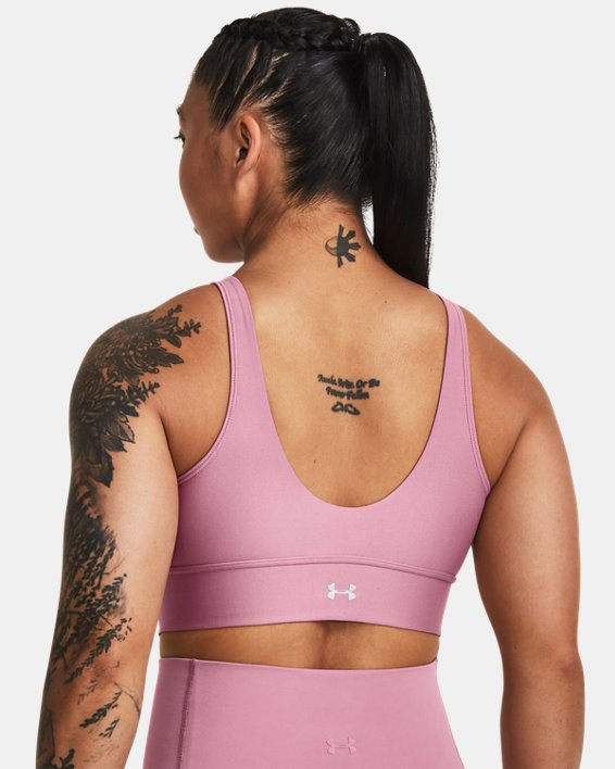 Women's UA Infinity Mid Pintuck Sports Bra in Pink image number 1